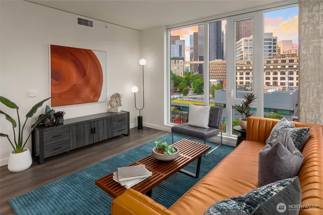 a living room with furniture and a rug