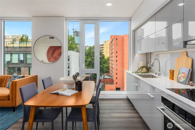 a view of a dining room with furniture window and wooden floor