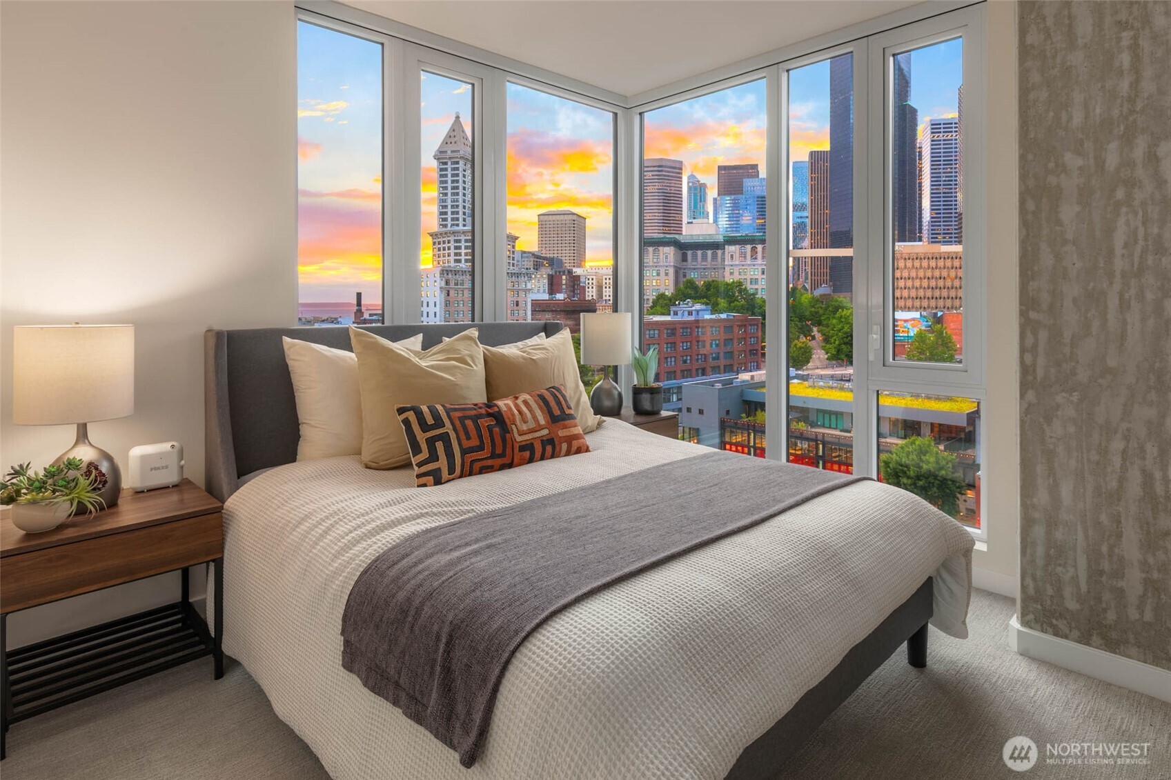 450 South Main Street, Unit 901 Seattle, WA 98104 - Photo 9 of 36 a bedroom with a bed and large windows