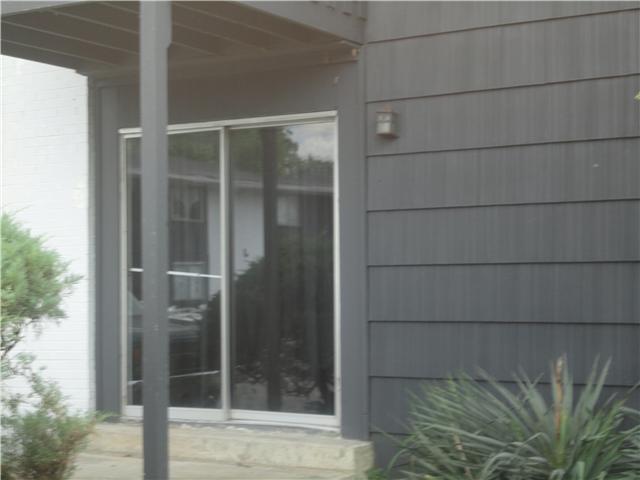 320 Welch Road, Unit M1 Nashville, TN 37211 - Photo 14 of 14 This shot shows the covered patio with large shrubs surrounding it for privacy; only steps to the parking area.