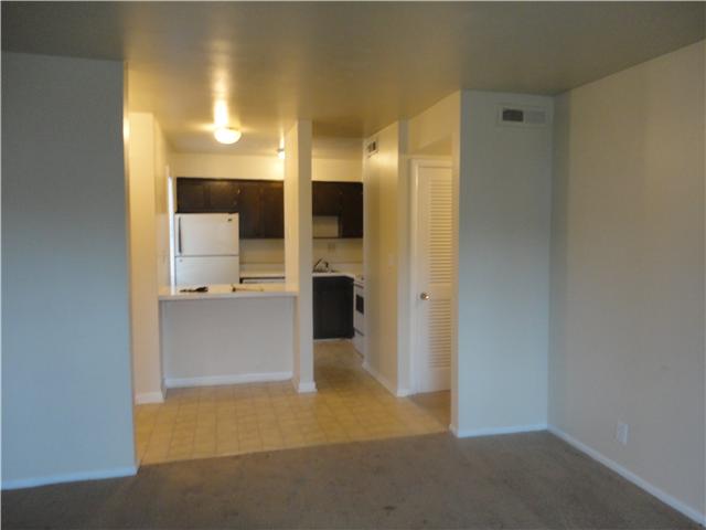 320 Welch Road, Unit M1 Nashville, TN 37211 - Photo 3 of 14 From the living room you get a view of the kitchenette with refrigerator, stove, dishwasher; ample storage area and a window for viewing your guests as they arrive
