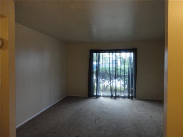 320 Welch Road, Unit M1 Nashville, TN 37211 - Photo 6 of 14 From the kitchen you see the living room with sliding glass doors looking out on the covered patio; that has large shrubs for your privacy.