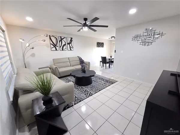 a work room with furniture and wooden floor