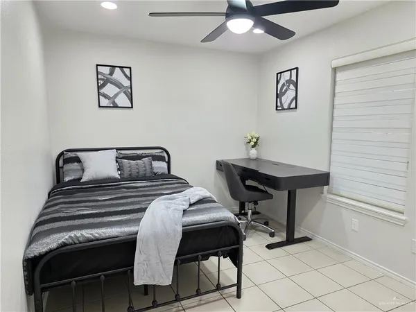 a bedroom with a bed and a table in it