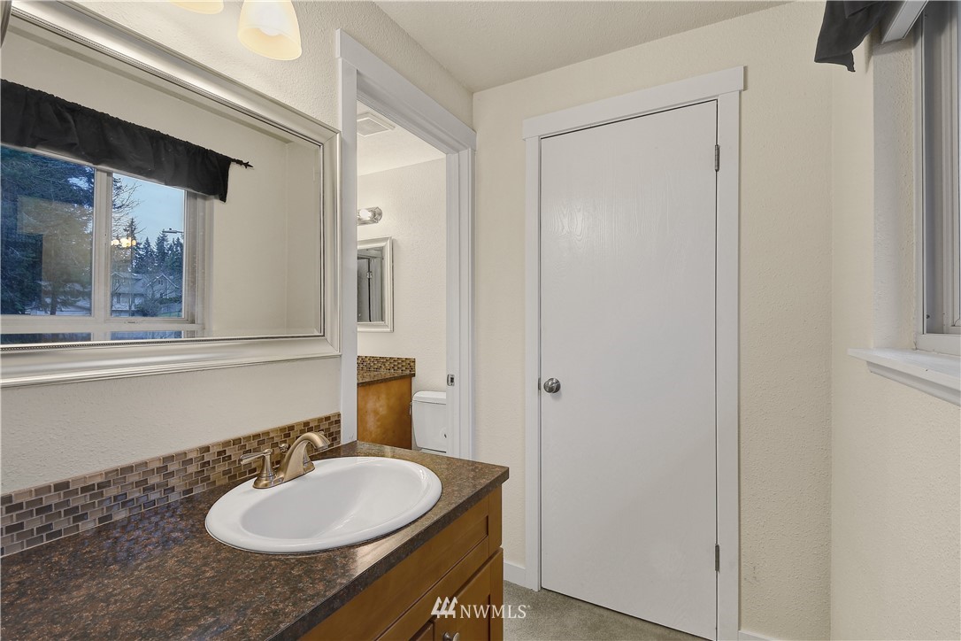 1104 204th Place Southeast Bothell, WA 98012 - Photo 11 of 22 a bathroom with a sink and a mirror