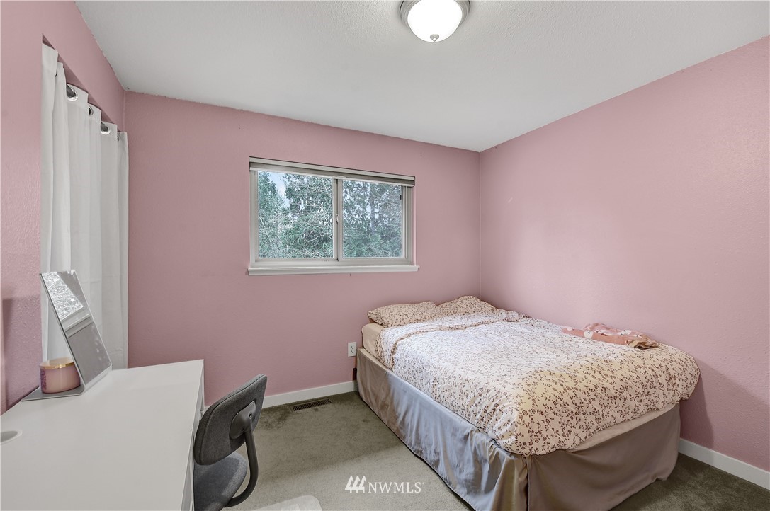 1104 204th Place Southeast Bothell, WA 98012 - Photo 14 of 22 a bedroom with a bed and a window
