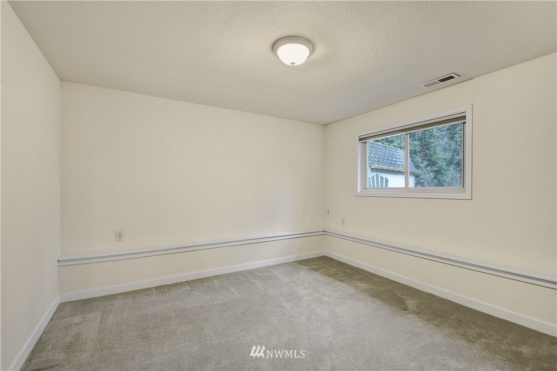 1104 204th Place Southeast Bothell, WA 98012 - Photo 17 of 22 a view of an empty room with a window