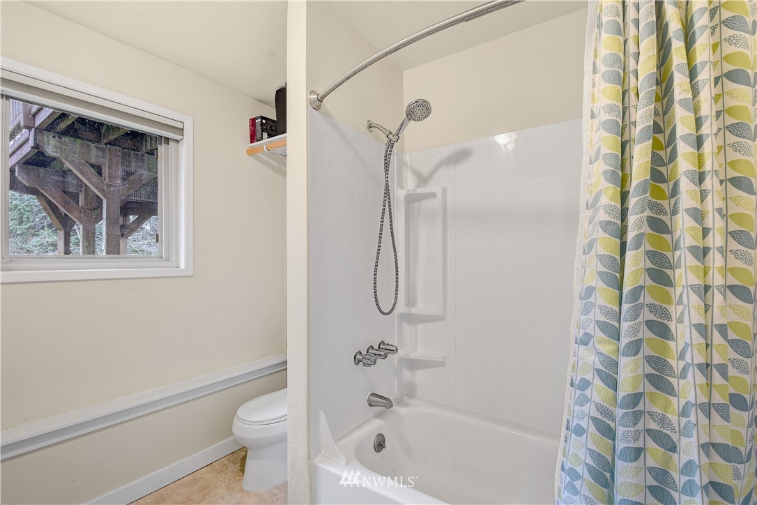 1104 204th Place Southeast Bothell, WA 98012 - Photo 19 of 22 a bathroom with a shower a toilet and a shower