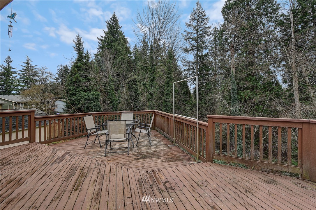 1104 204th Place Southeast Bothell, WA 98012 - Photo 20 of 22 a view of a deck with furniture and wooden floor