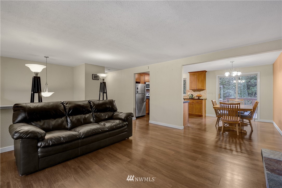 1104 204th Place Southeast Bothell, WA 98012 - Photo 7 of 22 a living room with furniture and wooden floor