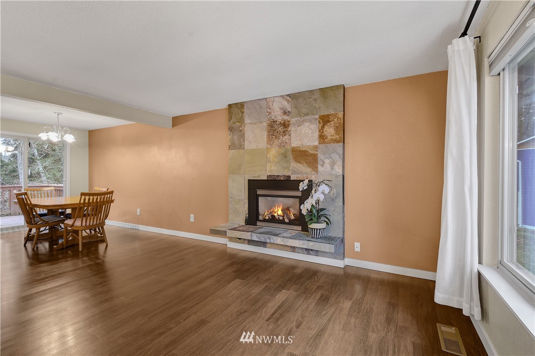 1104 204th Place Southeast Bothell, WA 98012 - Photo 8 of 22 a view of a room with wooden floor table and chairs