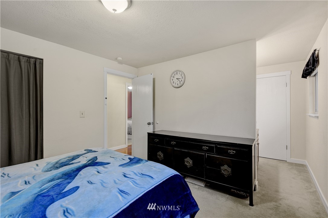 1104 204th Place Southeast Bothell, WA 98012 - Photo 10 of 22 a bedroom with a bed and a dresser