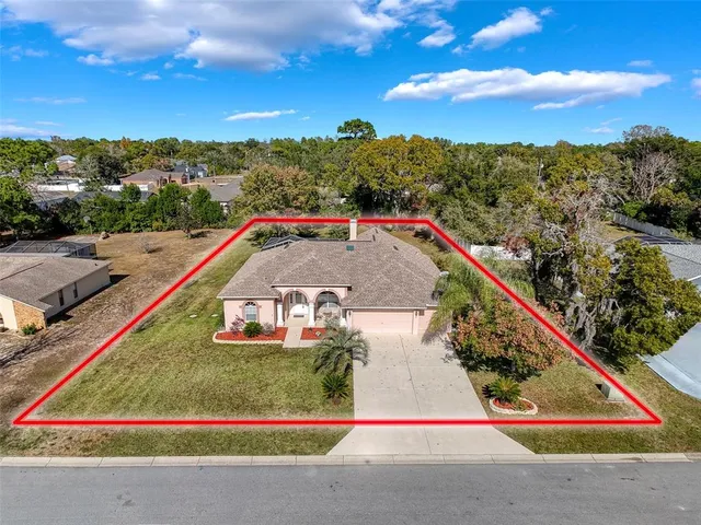 a view of swimming pool with a yard and mountain view