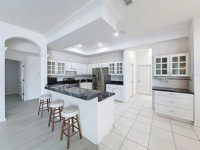 an empty room with a fan and a fan