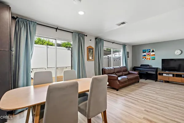 a kitchen with stainless steel appliances granite countertop a stove cabinets and refrigerator