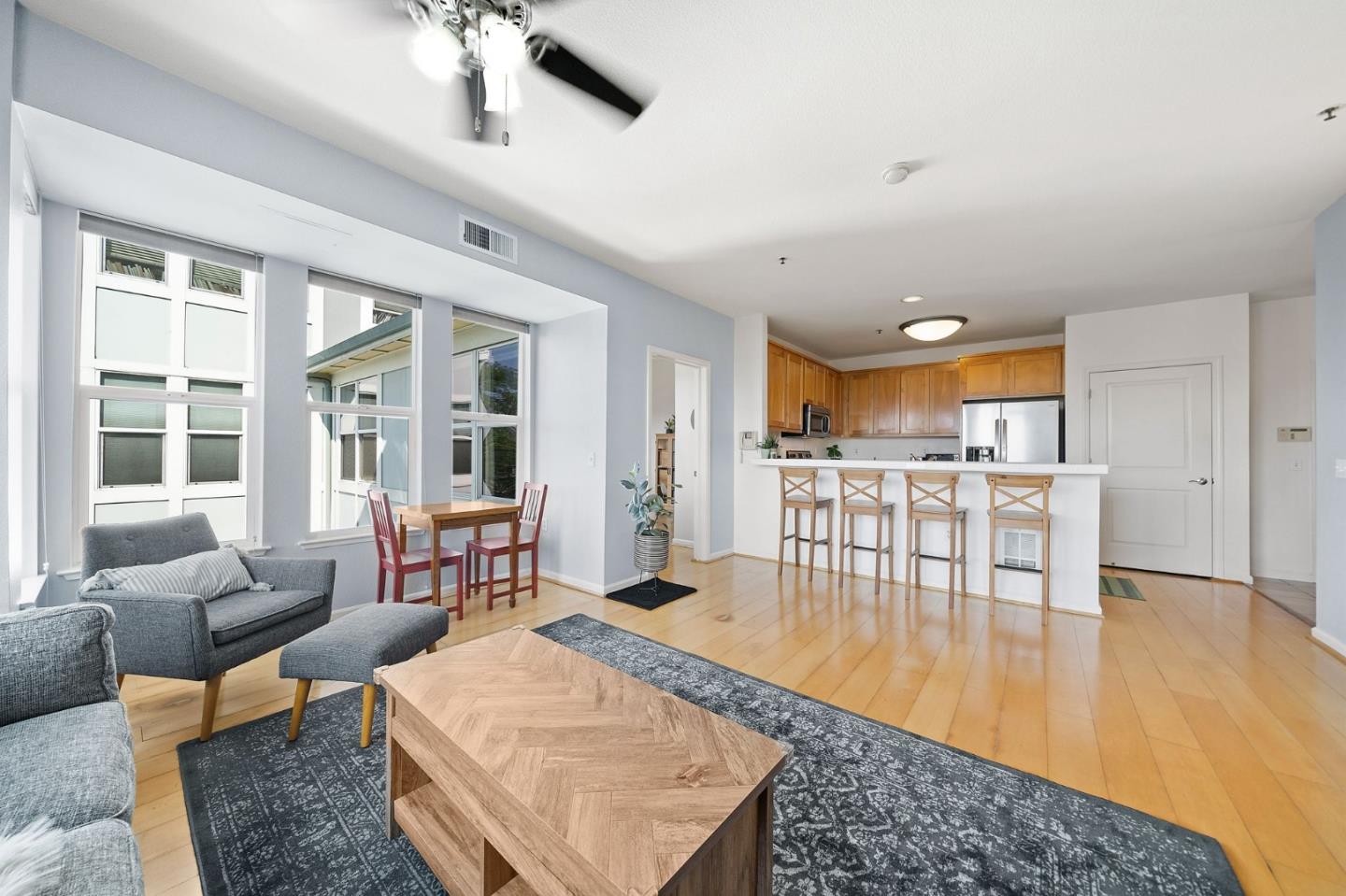 655 12th Street, Unit 312 Oakland, CA 94607 - Photo 4 of 14 a living room with furniture and a table