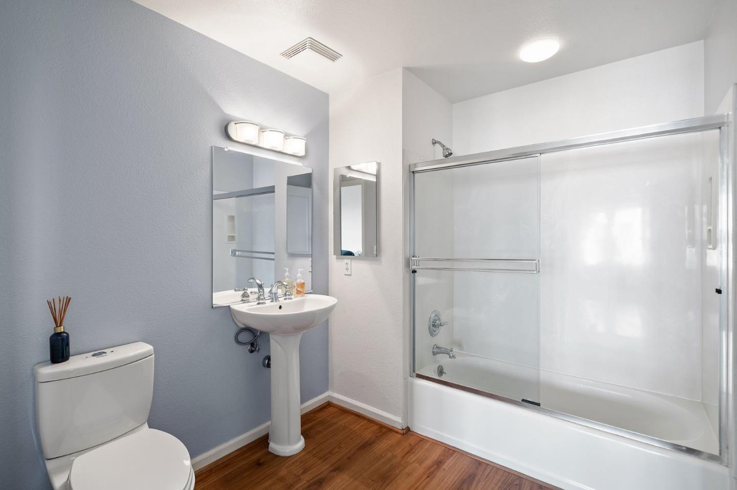 655 12th Street, Unit 312 Oakland, CA 94607 - Photo 10 of 14 a bathroom with a sink toilet and shower