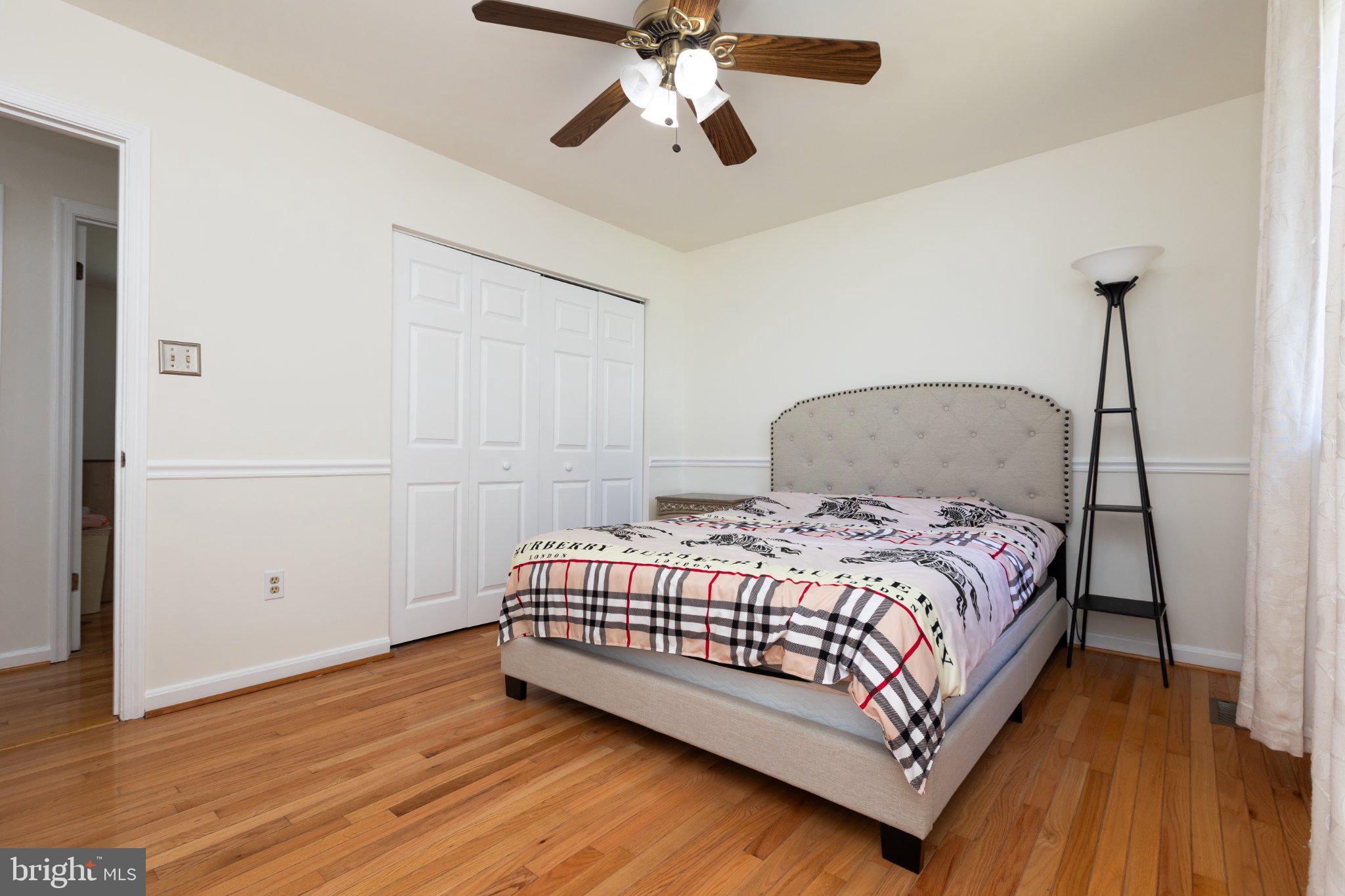 3613 Rusty Rim Ellicott City, MD 21043 - Photo 21 of 39 Cozy bedroom with warm wood floors.