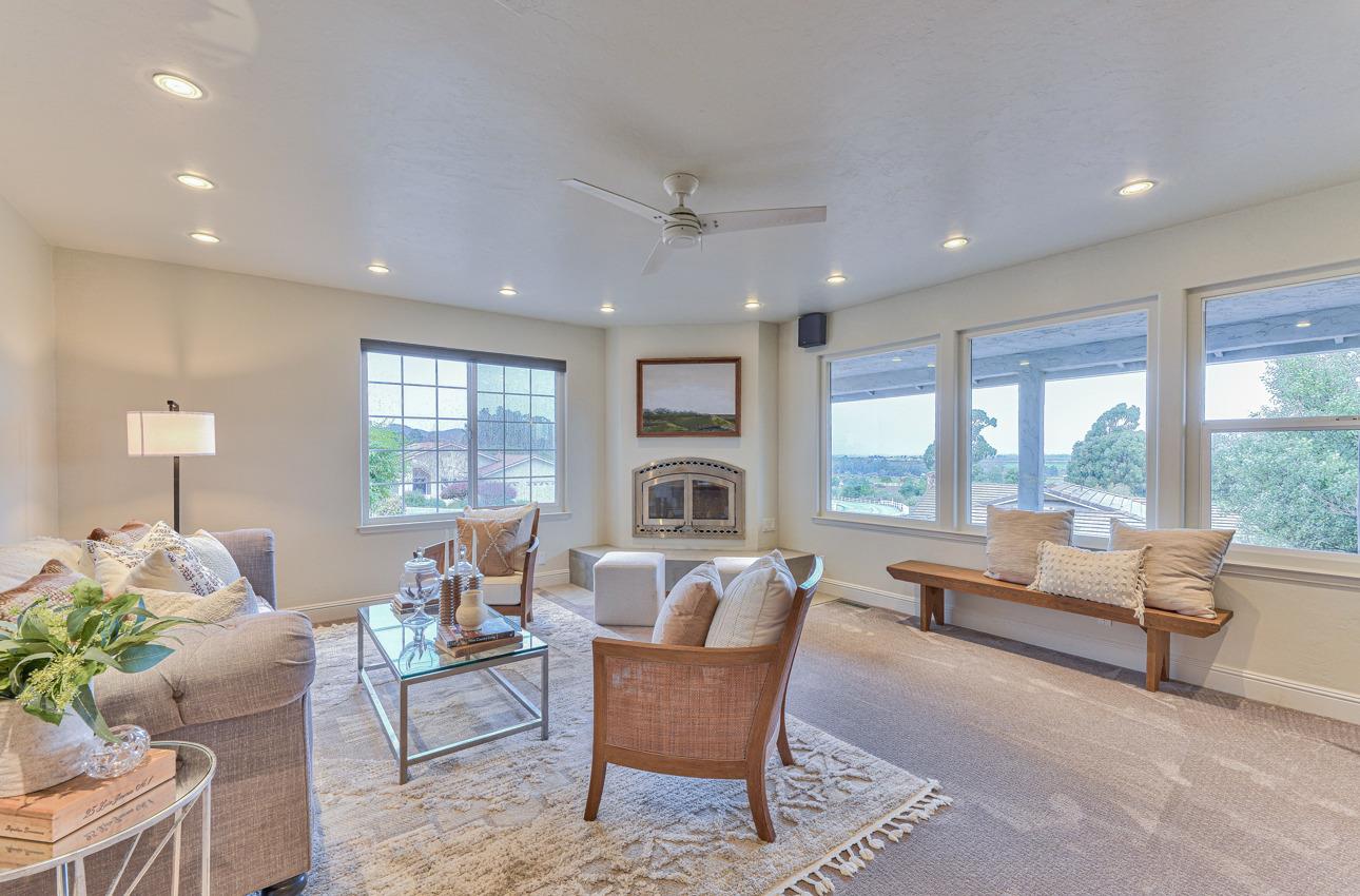 22511 Murietta Road Salinas, CA 93908 - Photo 11 of 58 a living room with furniture fireplace and large windows