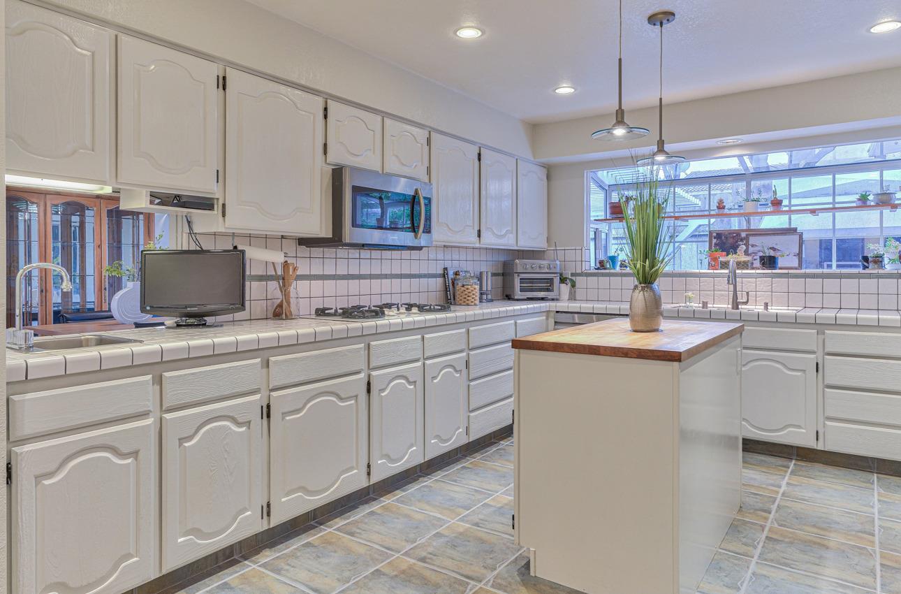 22511 Murietta Road Salinas, CA 93908 - Photo 24 of 58 a kitchen with cabinets appliances a sink and a counter top space