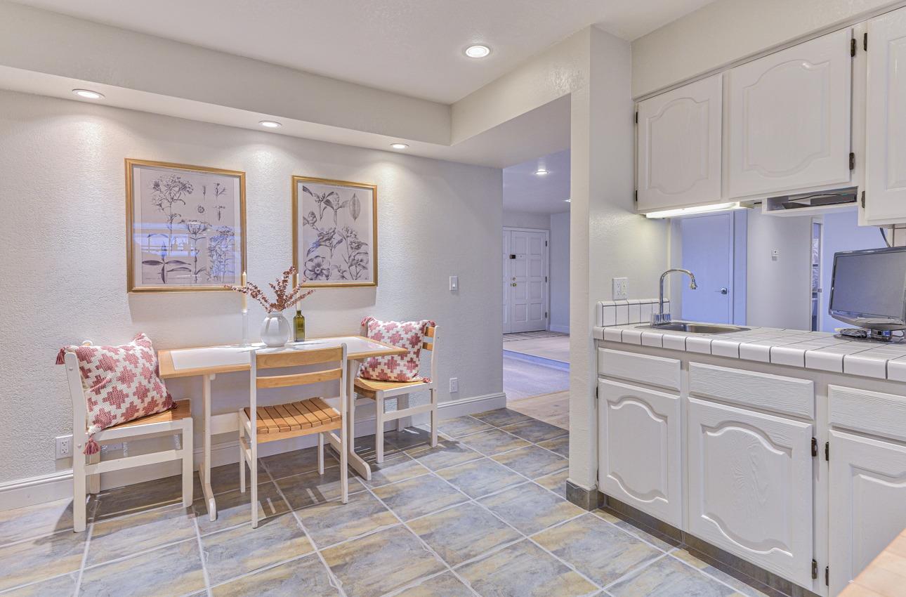 22511 Murietta Road Salinas, CA 93908 - Photo 28 of 58 a dining room with granite countertop furniture and a painting on the wall