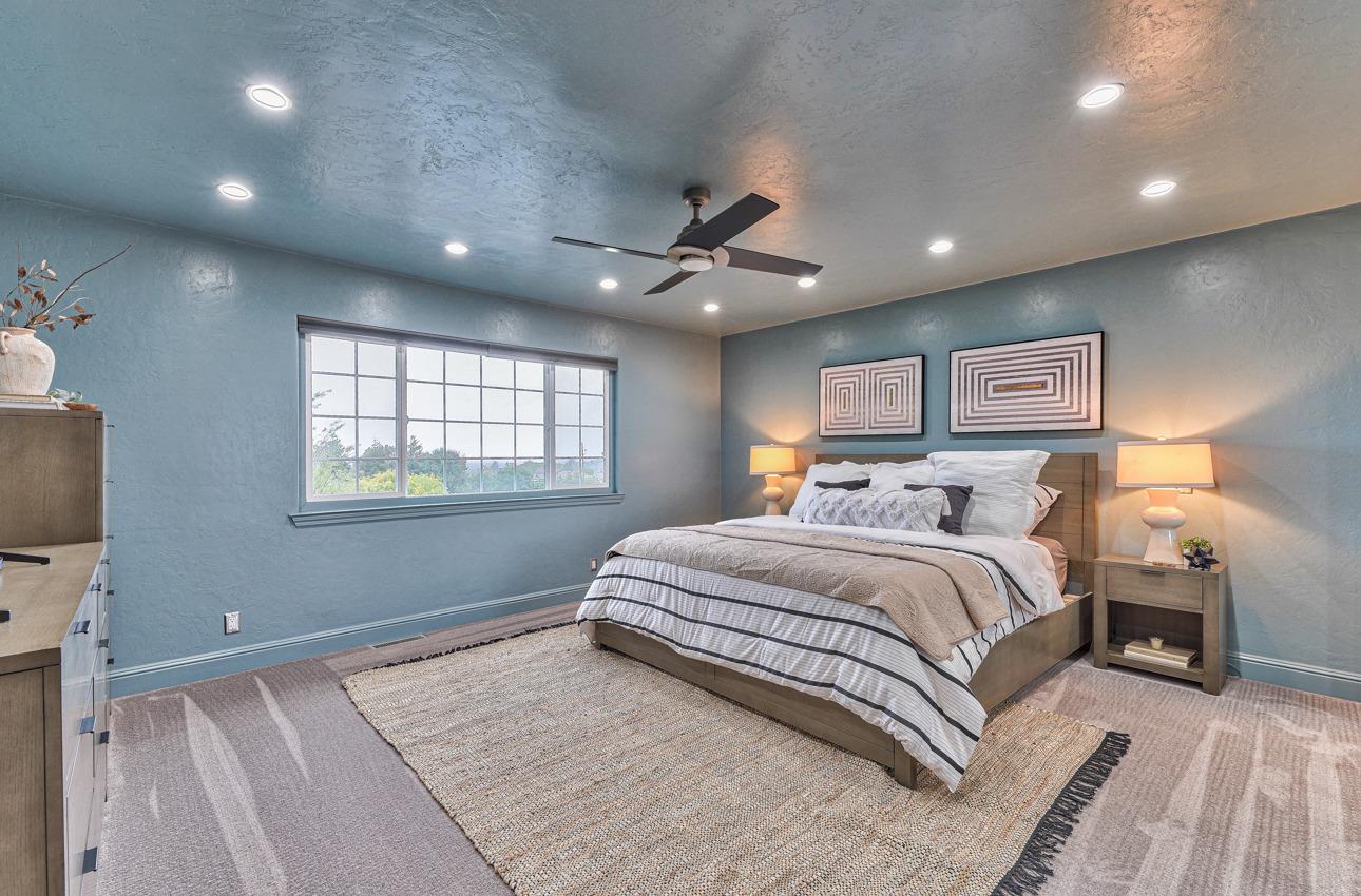 22511 Murietta Road Salinas, CA 93908 - Photo 38 of 58 a spacious bedroom with a large bed and a window