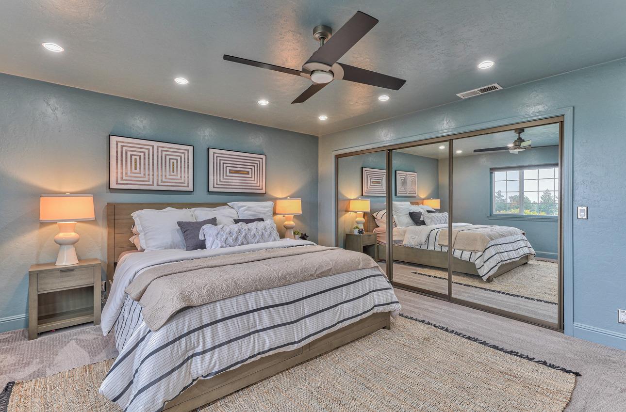 22511 Murietta Road Salinas, CA 93908 - Photo 41 of 58 a spacious bedroom with a large bed and a couch