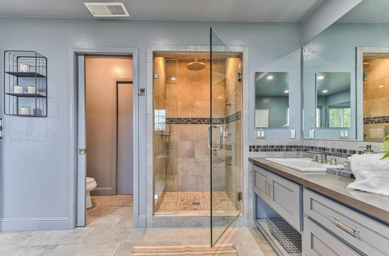 22511 Murietta Road Salinas, CA 93908 - Photo 45 of 58 a bathroom with a shower sink and mirror