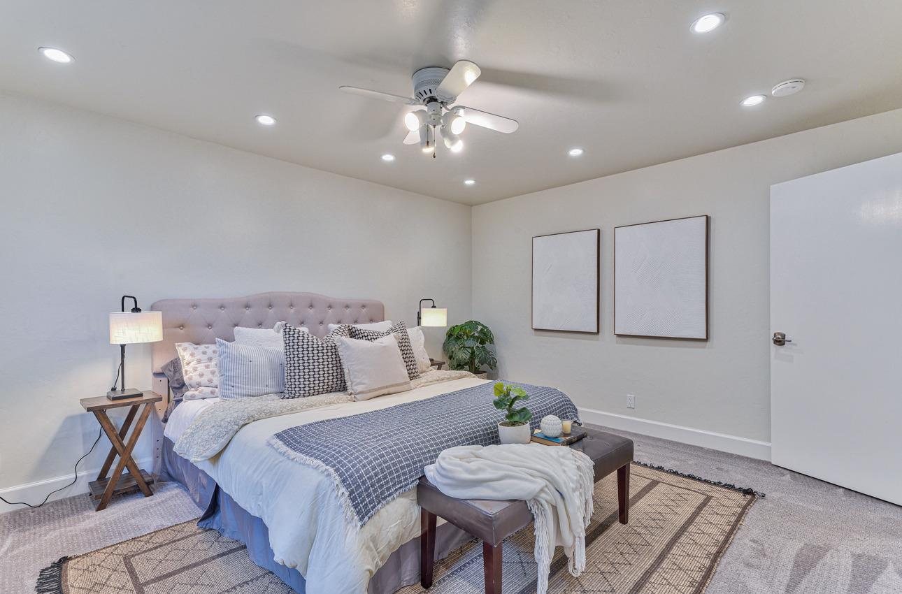 22511 Murietta Road Salinas, CA 93908 - Photo 47 of 58 a bed room with a bed and a chandelier