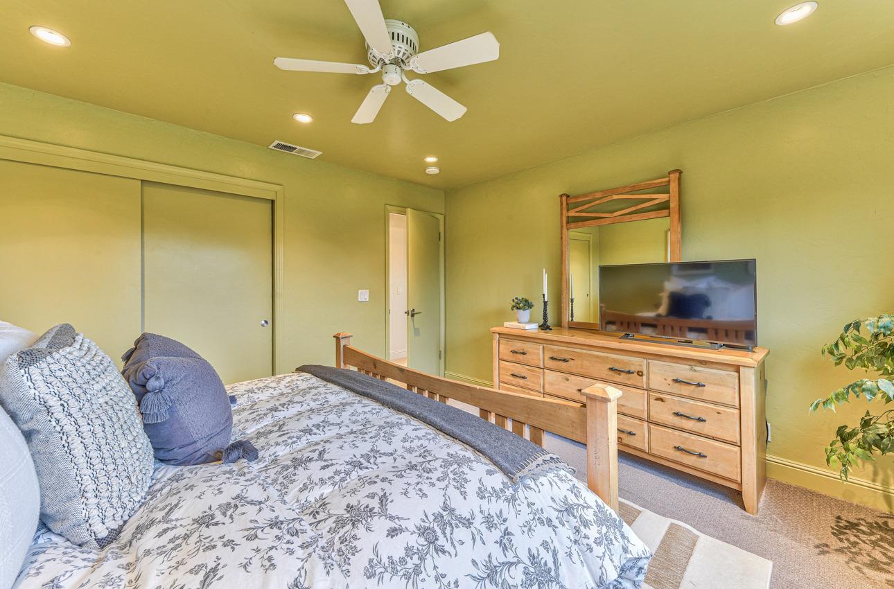 22511 Murietta Road Salinas, CA 93908 - Photo 50 of 58 a bedroom with a bed and a dresser in it