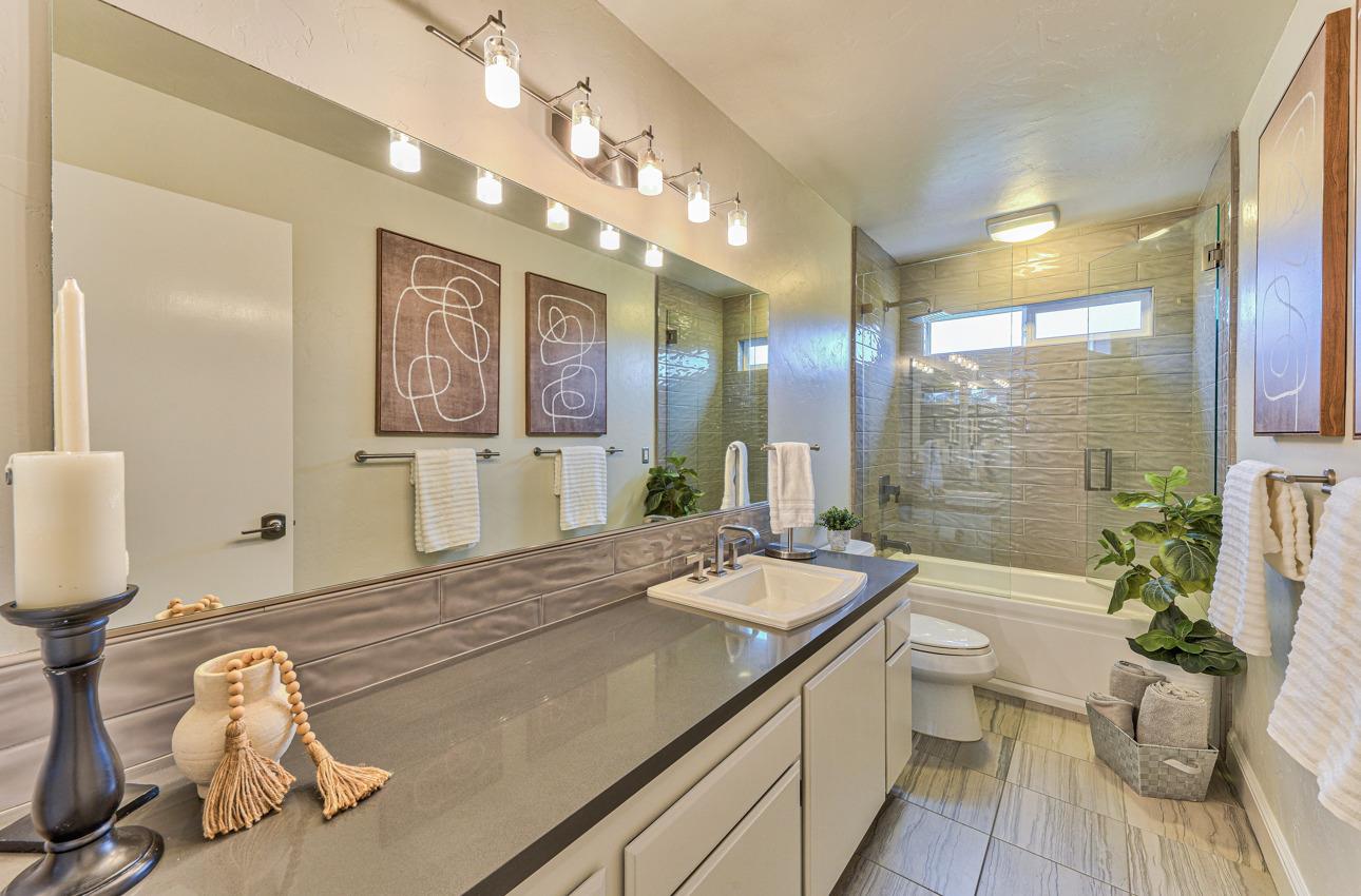 22511 Murietta Road Salinas, CA 93908 - Photo 51 of 58 a spacious bathroom with a sink a large mirror and a shower