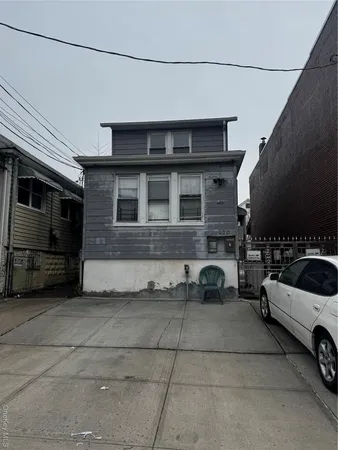 a view of a car park in front of house