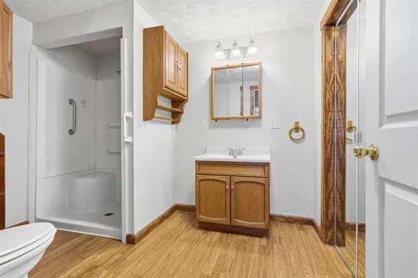 a bathroom with a mirror and a shower