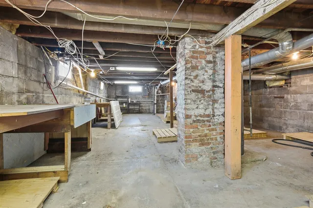a view of empty room with wooden walls