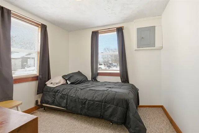 a bedroom with a bed and window