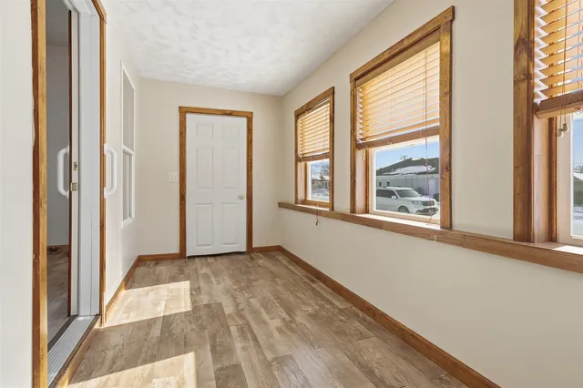 a view of an empty room with windows