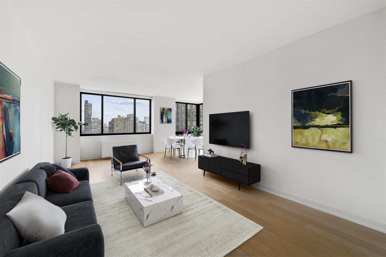 1 Columbus Place, Unit N31B Manhattan, NY 10019 - Photo 1 of 8 a living room with furniture and a flat screen tv