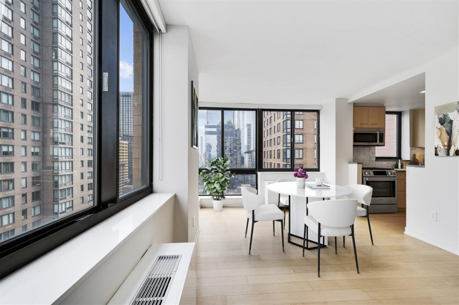 1 Columbus Place, Unit N31B Manhattan, NY 10019 - Photo 3 of 8 a living room with furniture and large windows