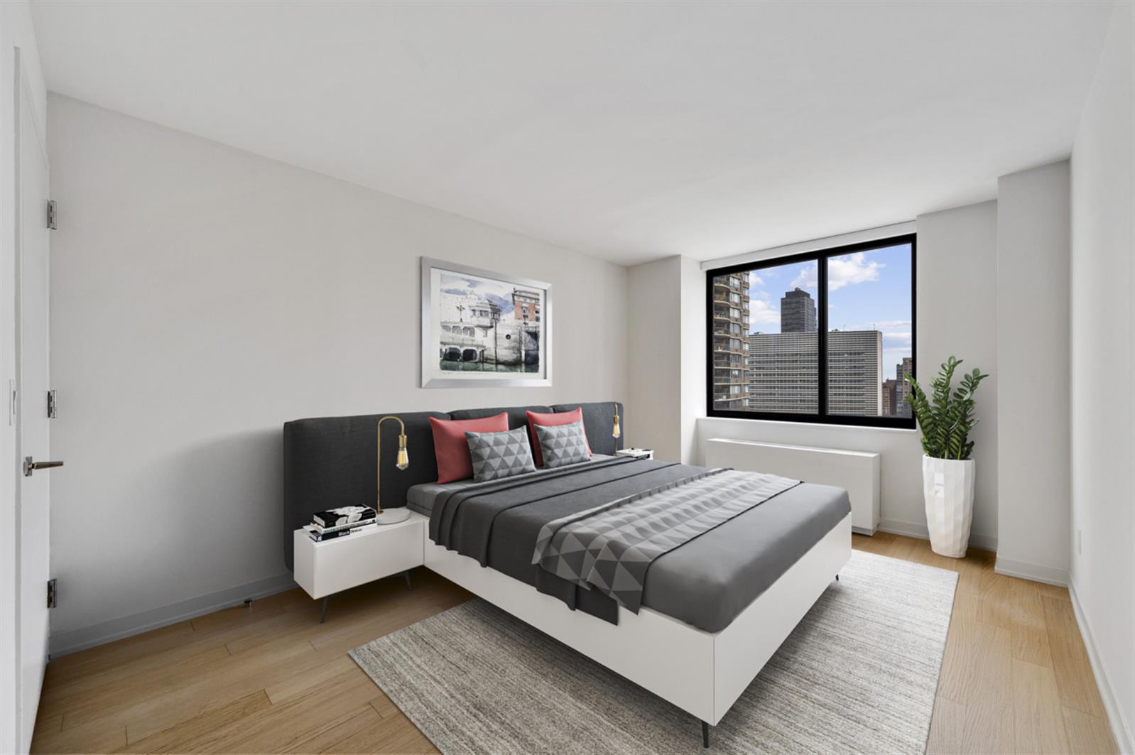 1 Columbus Place, Unit N31B Manhattan, NY 10019 - Photo 5 of 8 a bedroom with a large bed and a couch