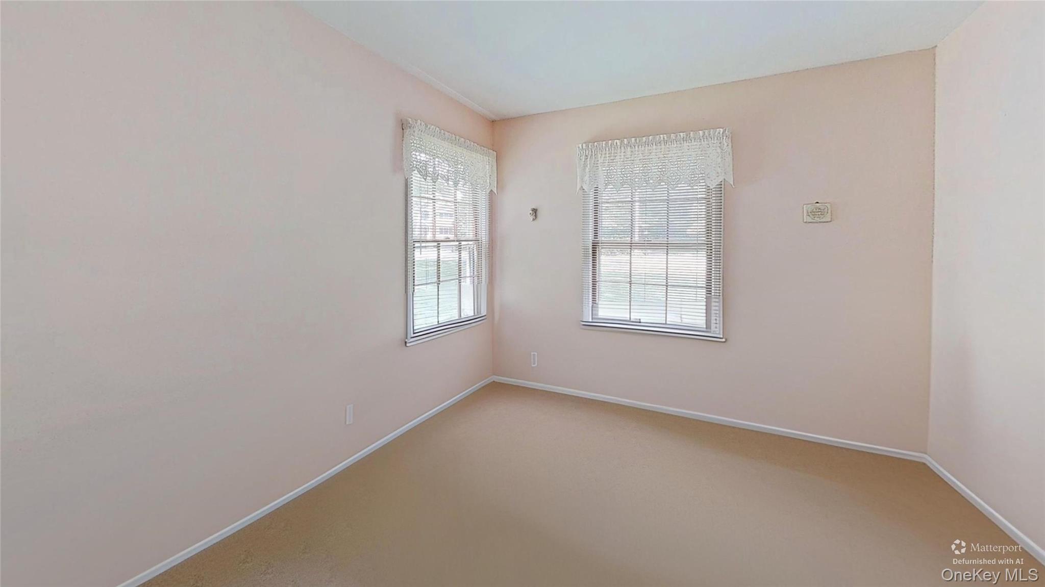347 Miller Place Road Miller Place, NY 11764 - Photo 15 of 29 Corner Bedroom featured in a Defurnished photo!