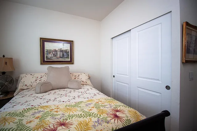 a bedroom with a bed and a window