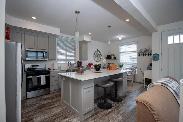 a kitchen with counter top space appliances and cabinets
