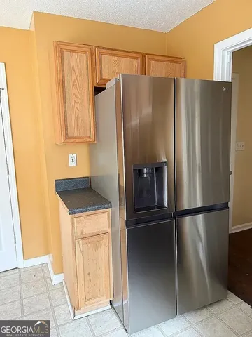 a bedroom with a bed and a cabinets