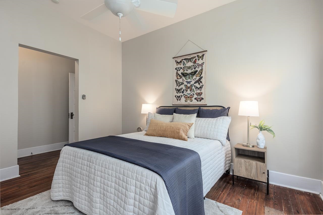 519 Summitt Street Memphis, TN 38104 - Photo 25 of 40 a bedroom with a bed and wooden floor