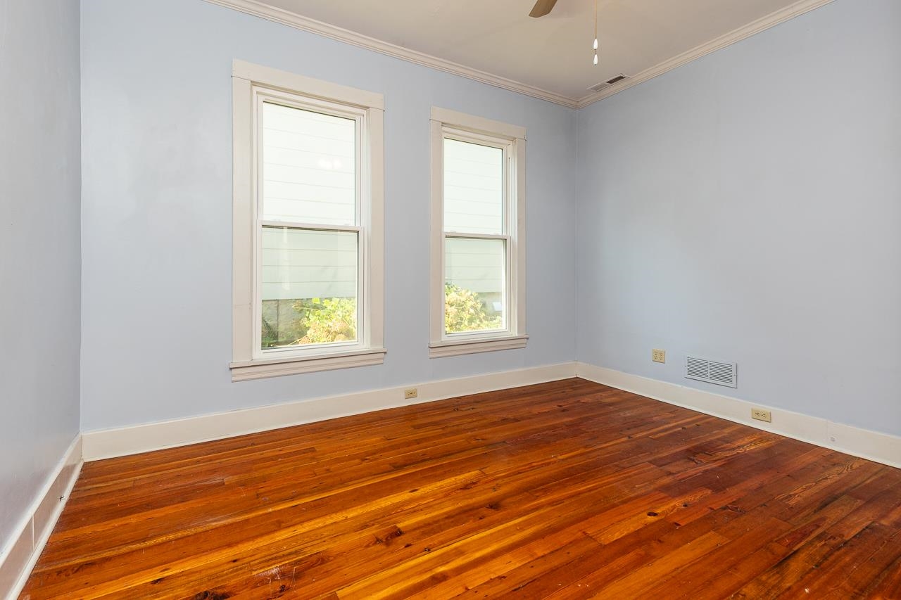 519 Summitt Street Memphis, TN 38104 - Photo 28 of 40 an empty room with wooden floor and windows