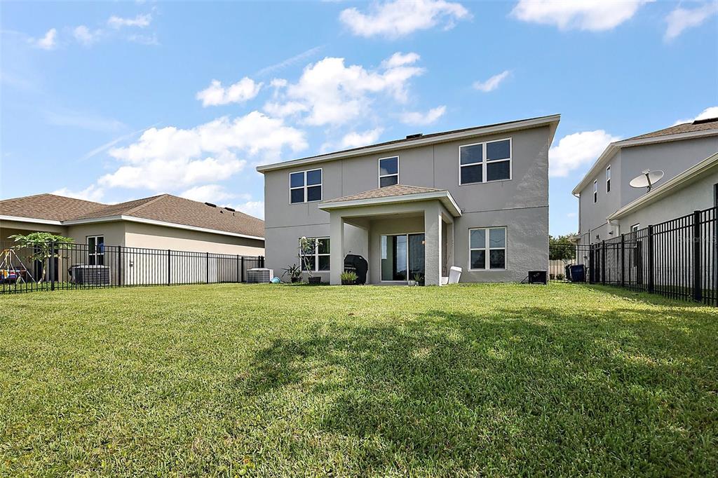 1292 Cavender Creek Road Minneola, FL 34715 - Photo 30 of 36 a view of house with yard and entertaining space