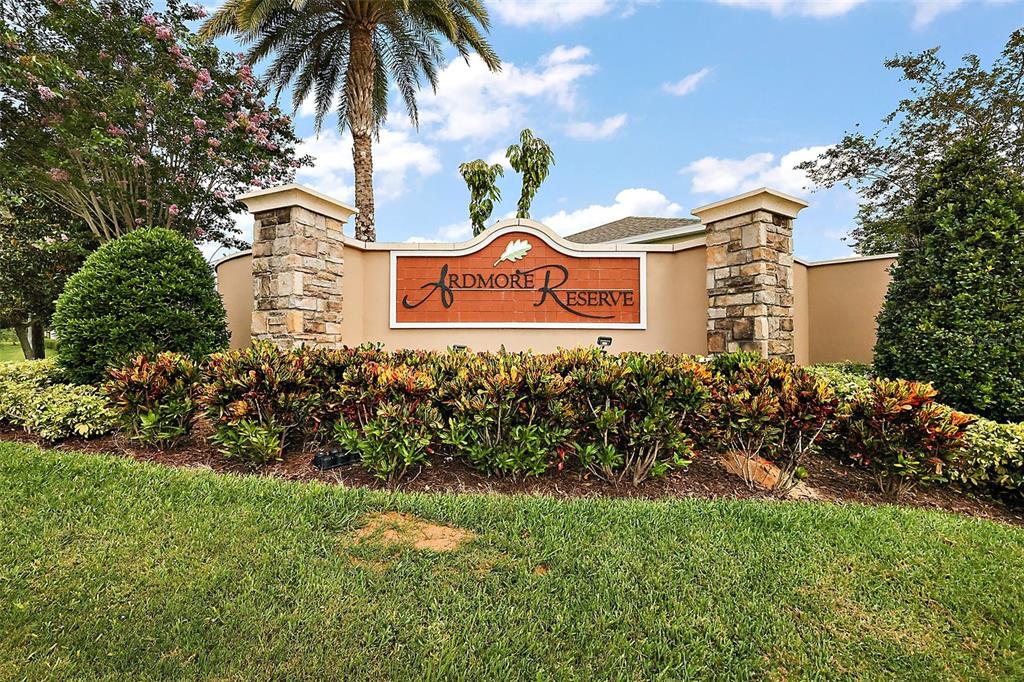 1292 Cavender Creek Road Minneola, FL 34715 - Photo 36 of 36 a view of a white house with a yard and potted plants