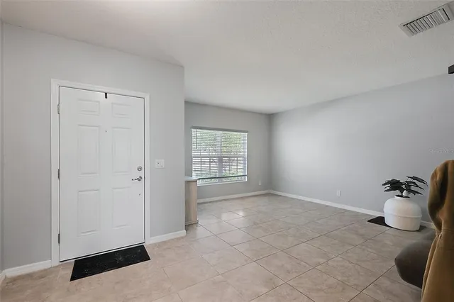 a view of an empty room and window