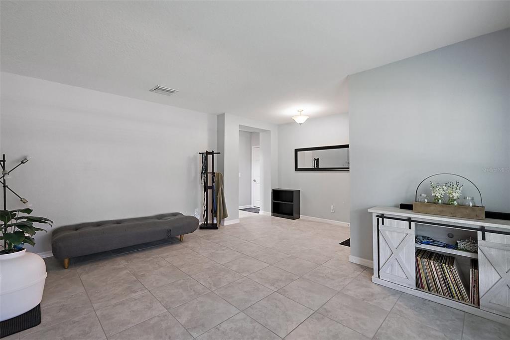 1292 Cavender Creek Road Minneola, FL 34715 - Photo 6 of 36 a view of a livingroom with furniture