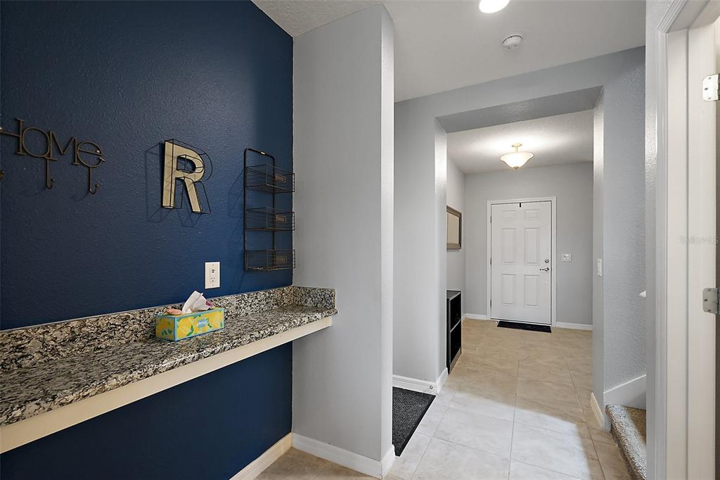 1292 Cavender Creek Road Minneola, FL 34715 - Photo 7 of 36 a bathroom with a granite countertop sink